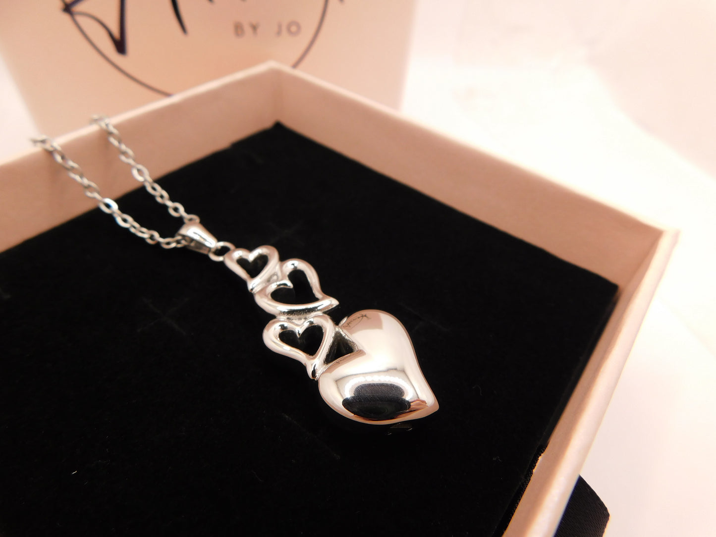 Tumbling hearts urn pendant